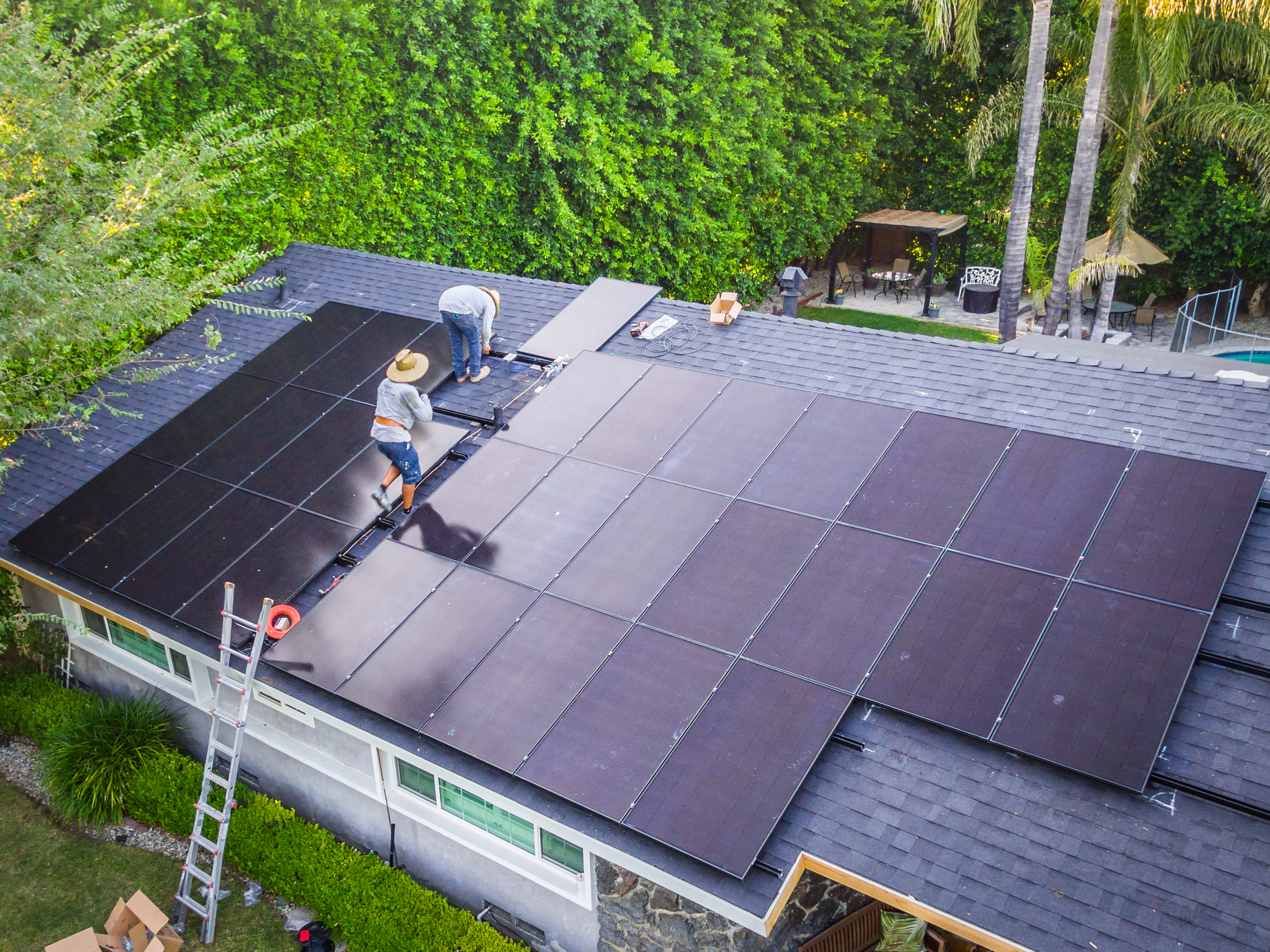 Solar panels being installed on a residential roof